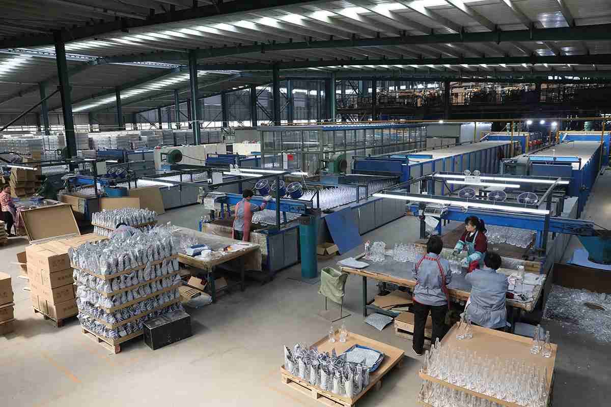 Bottles on pallets and worktables in a production workshop